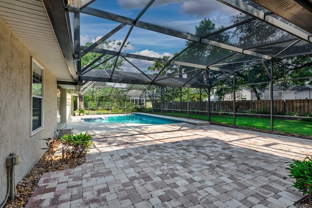 1947 Broadleaf Ct, Windermere, FL 34786 - view of swimming pool featuring glass enclosure and a patio