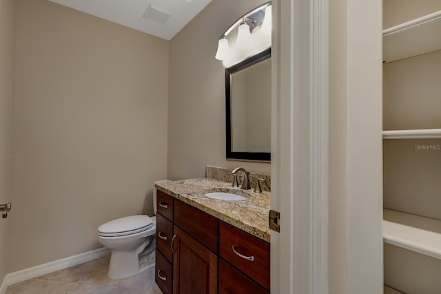 1947 Broadleaf Ct, Windermere, FL 34786 - bathroom featuring vanity, toilet, tile patterned flooring, and baseboards
