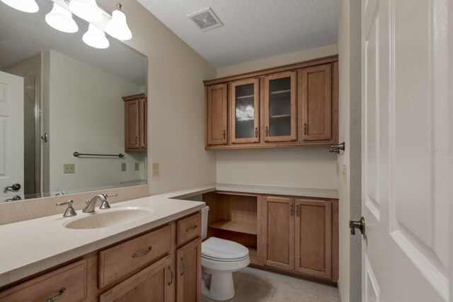 1947 Broadleaf Ct, Windermere, FL 34786 - bathroom with vanity, toilet, tile patterned floors, and a textured ceiling