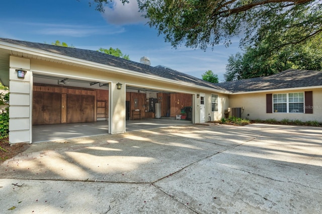 1947 Broadleaf Ct, Windermere, FL 34786 - view of side of home featuring concrete driveway, a garage, stucco siding, a chimney, and a shingled roof