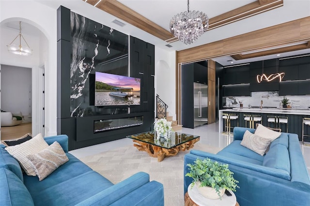 9259 Tibet Pointe Cir, Windermere, FL 34786 - living room featuring a chandelier and arched walkways