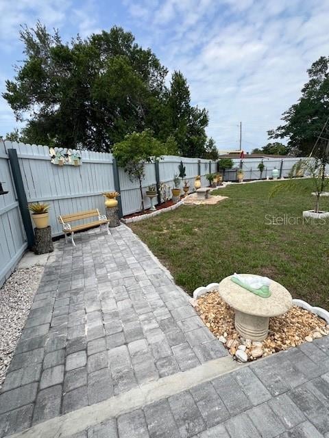 1620 Hialeah St, Orlando, FL 32808 - view of yard featuring a patio area