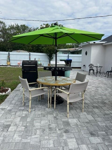 1620 Hialeah St, Orlando, FL 32808 - view of patio with outdoor dining space and area for grilling