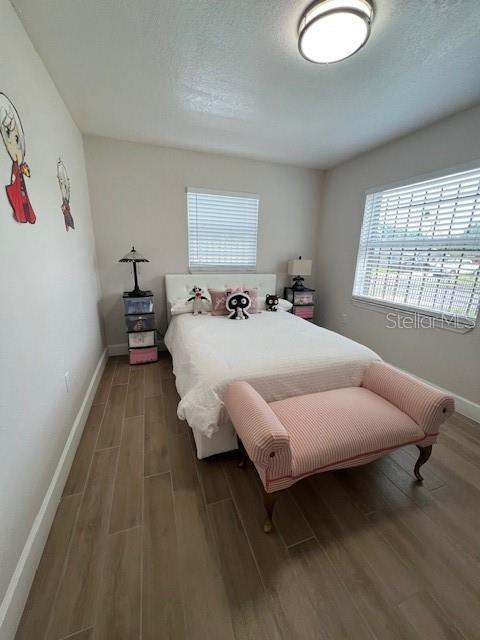 1620 Hialeah St, Orlando, FL 32808 - bedroom with wood finished floors and baseboards