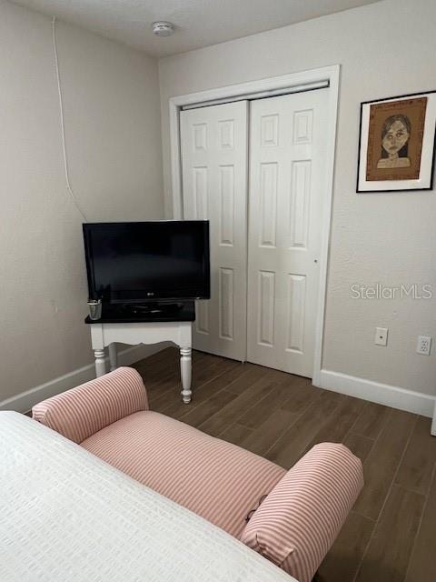 1620 Hialeah St, Orlando, FL 32808 - living area with baseboards and wood finished floors