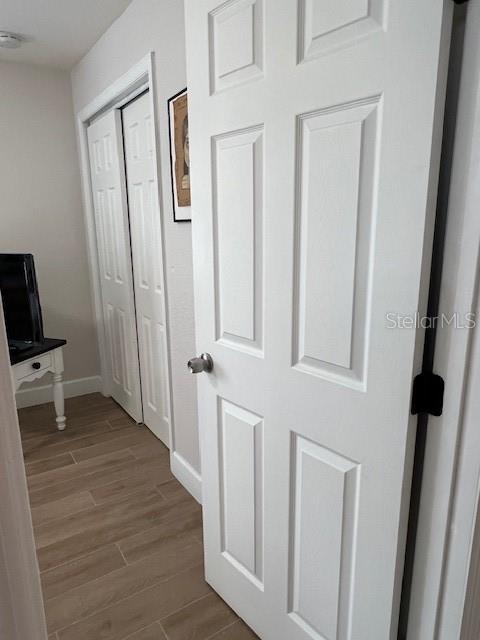 1620 Hialeah St, Orlando, FL 32808 - hall with baseboards and wood finished floors