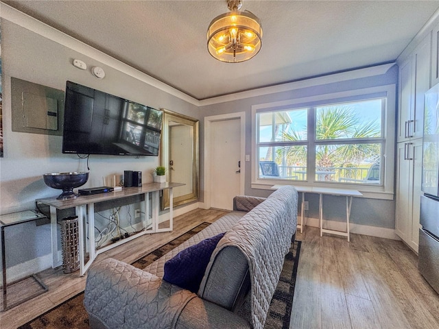 935 S Atlantic Ave Unit 244, Daytona Beach, FL 32118 - living area with baseboards, wood finished floors, and electric panel