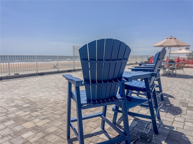 935 S Atlantic Ave Unit 244, Daytona Beach, FL 32118 - view of patio with a water view and outdoor dining space