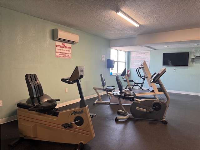 935 S Atlantic Ave Unit 244, Daytona Beach, FL 32118 - gym featuring a wall mounted AC, a textured ceiling, and baseboards