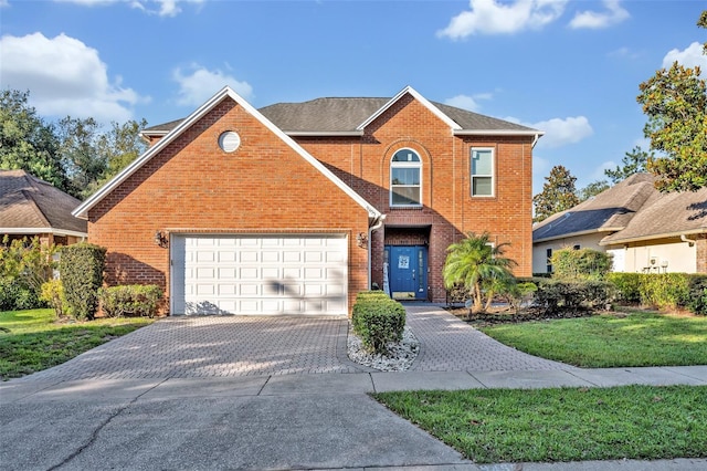 9455 Belmont Ter, Oviedo, FL 32765 - traditional-style house featuring brick siding, decorative driveway, a front yard, and an attached garage