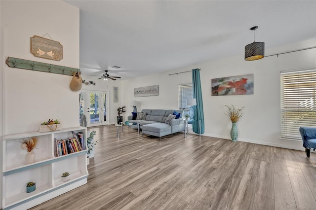 9455 Belmont Ter, Oviedo, FL 32765 - living room featuring wood finished floors, a ceiling fan, and baseboards