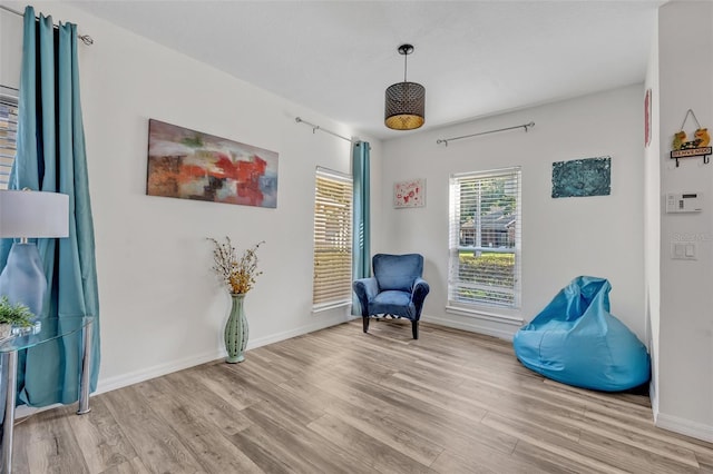 9455 Belmont Ter, Oviedo, FL 32765 - living area featuring light wood-type flooring and baseboards
