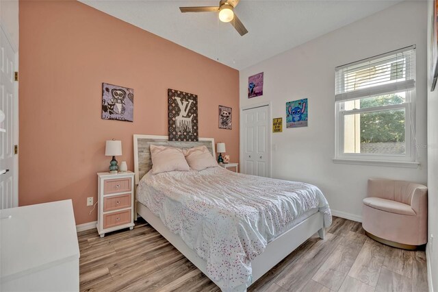 9455 Belmont Ter, Oviedo, FL 32765 - bedroom featuring light wood-style floors, baseboards, a closet, and a ceiling fan