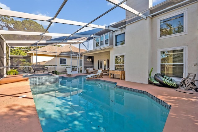 9455 Belmont Ter, Oviedo, FL 32765 - view of swimming pool featuring a patio area, a pool with connected hot tub, and a lanai