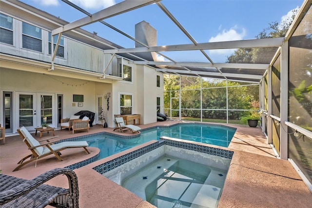 9455 Belmont Ter, Oviedo, FL 32765 - view of swimming pool with french doors, a patio area, glass enclosure, an outdoor living space, and a pool with connected hot tub