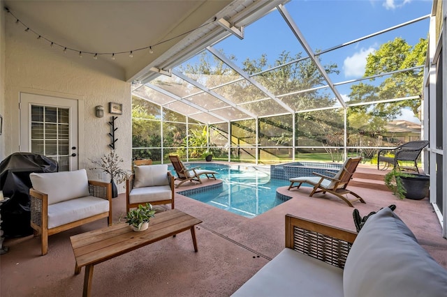 9455 Belmont Ter, Oviedo, FL 32765 - view of swimming pool with a patio area, an outdoor hangout area, a pool with connected hot tub, and glass enclosure