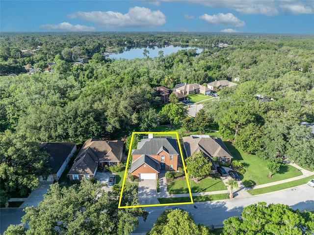 9455 Belmont Ter, Oviedo, FL 32765 - aerial view of residential area with a forest, a large body of water, and property boundaries highlighted