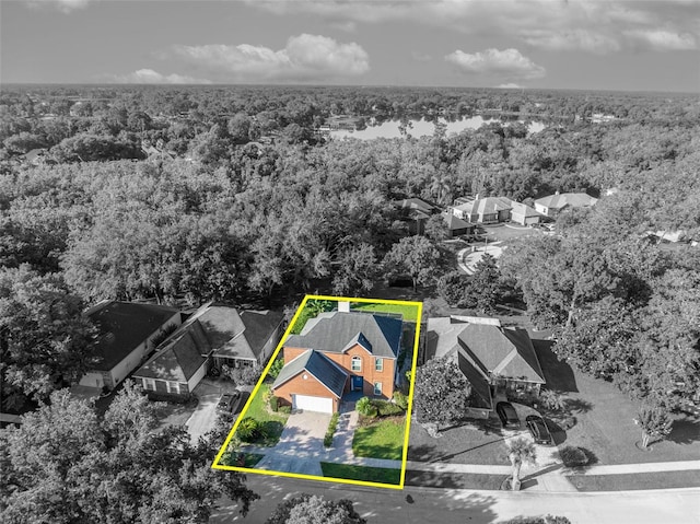 9455 Belmont Ter, Oviedo, FL 32765 - aerial perspective of suburban area featuring a heavily wooded area and property parcel outlined