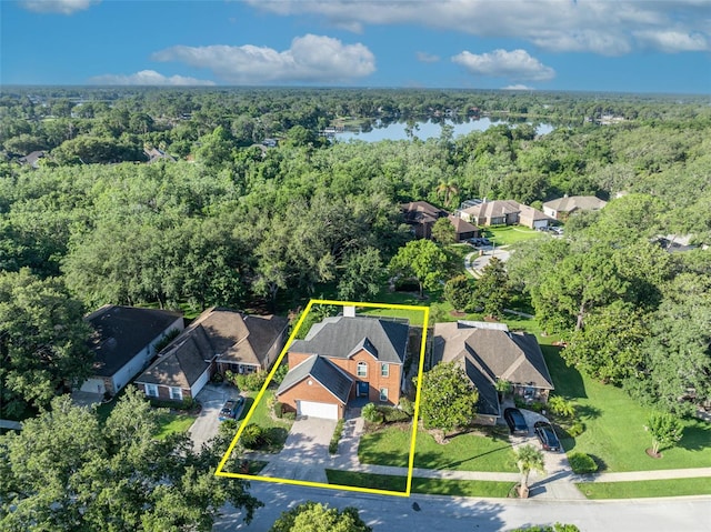 9455 Belmont Ter, Oviedo, FL 32765 - aerial view of residential area featuring a heavily wooded area, a large body of water, and property boundaries highlighted