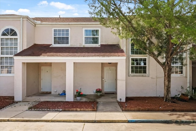 214 Majors Ln Unit C, Kissimmee, FL 34743 - multi unit property featuring stucco siding and covered porch