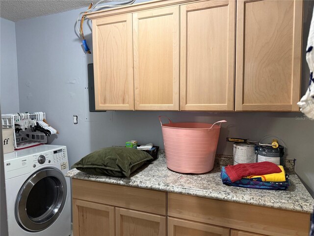 11314 Huggins St, Leesburg, FL 34788 - laundry room featuring washer / dryer, cabinet space, and a textured ceiling