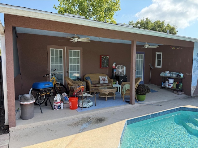 11314 Huggins St, Leesburg, FL 34788 - back of property with a ceiling fan, french doors, a patio area, an outdoor pool, and stucco siding