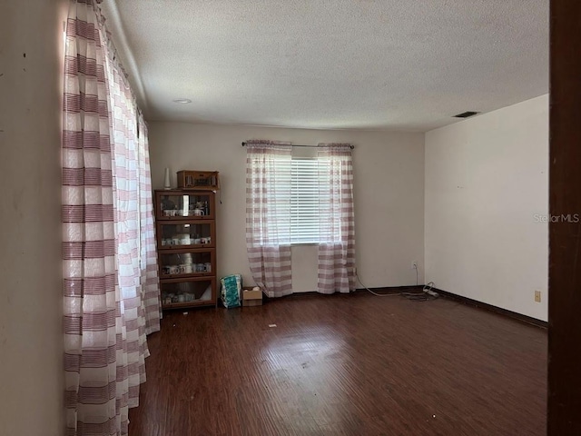 6616 Blanche Ct, Orlando, FL 32818 - unfurnished room with a textured ceiling and wood finished floors