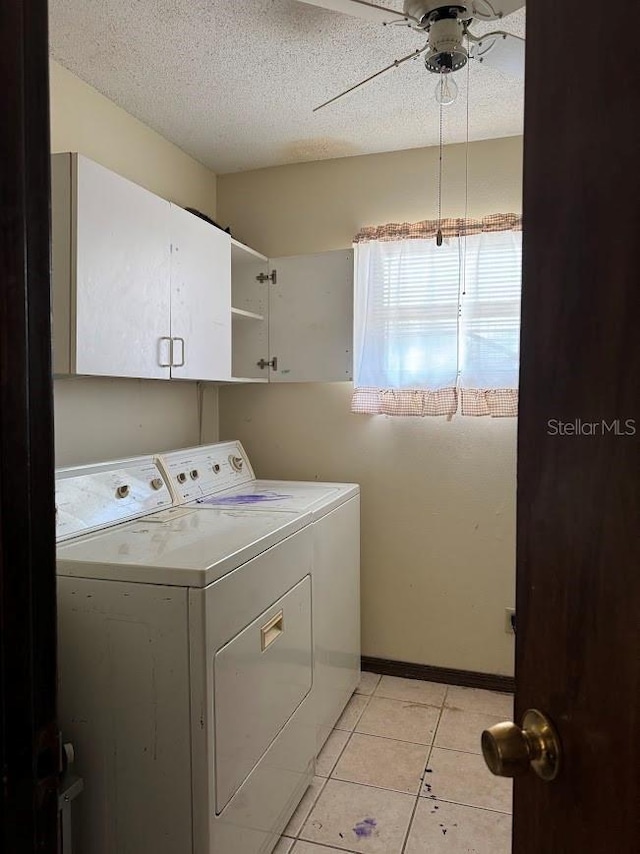 6616 Blanche Ct, Orlando, FL 32818 - laundry area featuring independent washer and dryer, cabinet space, a ceiling fan, light tile patterned floors, and a textured ceiling