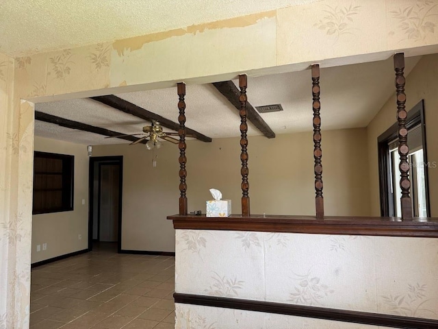 6616 Blanche Ct, Orlando, FL 32818 - kitchen with a textured ceiling, a ceiling fan, tile patterned floors, and baseboards