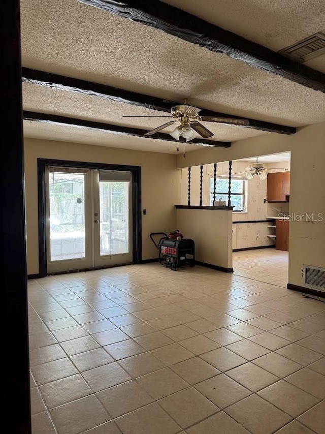 6616 Blanche Ct, Orlando, FL 32818 - unfurnished living room with a textured ceiling, french doors, tile patterned floors, and a ceiling fan