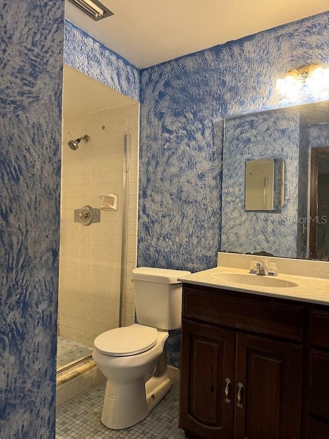 6616 Blanche Ct, Orlando, FL 32818 - bathroom with a shower stall, vanity, tile patterned floors, and toilet