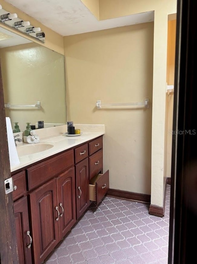 6616 Blanche Ct, Orlando, FL 32818 - bathroom featuring vanity and baseboards
