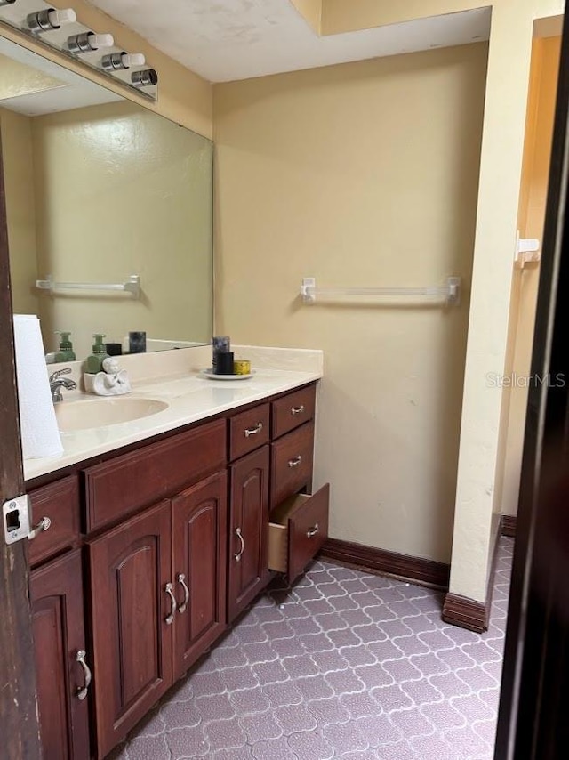 6616 Blanche Ct, Orlando, FL 32818 - bathroom featuring vanity and baseboards