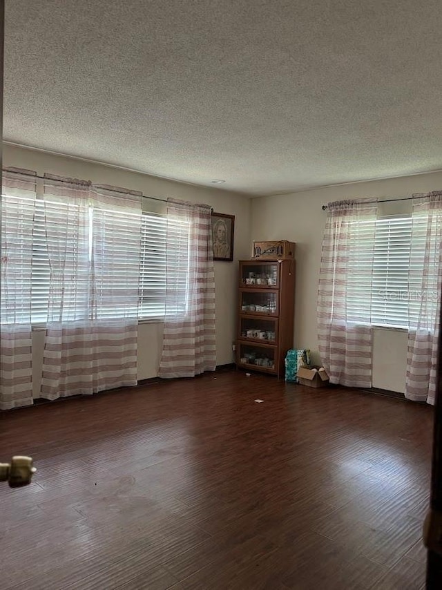 6616 Blanche Ct, Orlando, FL 32818 - unfurnished room featuring a textured ceiling and wood finished floors