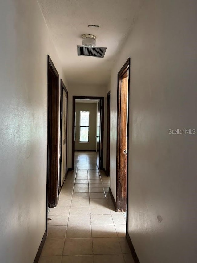 6616 Blanche Ct, Orlando, FL 32818 - hall with baseboards and light tile patterned flooring