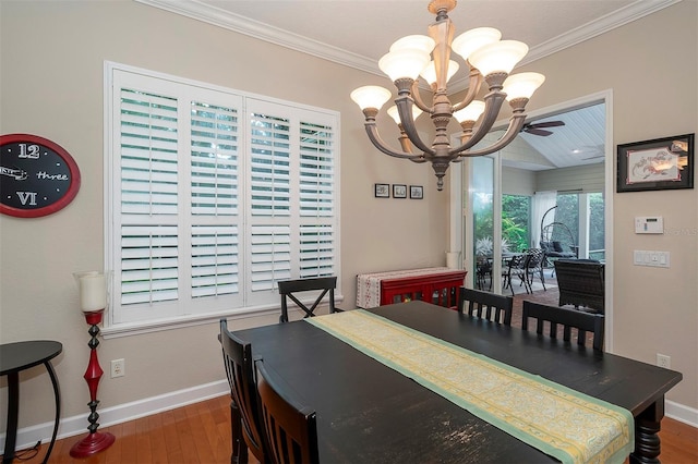 8335 Lake Burden Cir, Windermere, FL 34786 - dining room with a chandelier, baseboards, wood finished floors, and ornamental molding