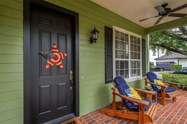 8335 Lake Burden Cir, Windermere, FL 34786 - view of exterior entry featuring covered porch and a ceiling fan