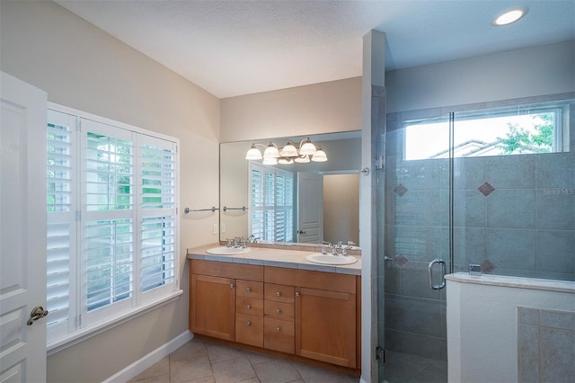 8335 Lake Burden Cir, Windermere, FL 34786 - bathroom with double vanity, tile patterned floors, a shower stall, baseboards, and a chandelier