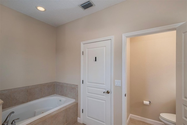 8335 Lake Burden Cir, Windermere, FL 34786 - full bath featuring a jetted tub, toilet, and baseboards