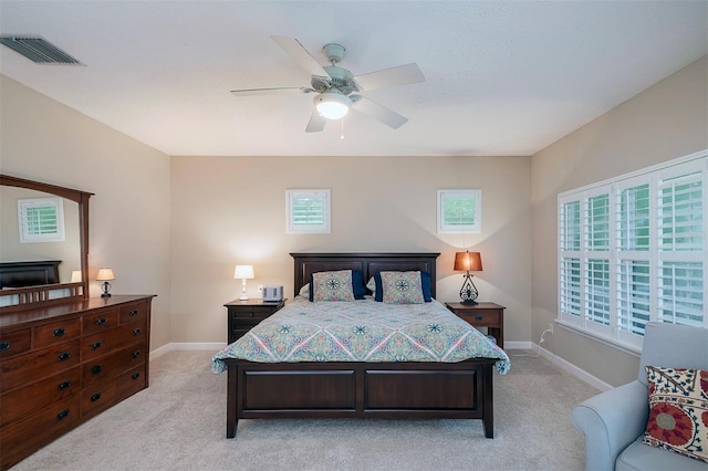 8335 Lake Burden Cir, Windermere, FL 34786 - bedroom with light carpet, baseboards, and a ceiling fan