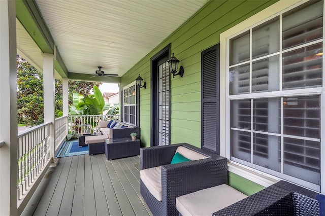 8335 Lake Burden Cir, Windermere, FL 34786 - wooden porch with a ceiling fan and outdoor lounge area
