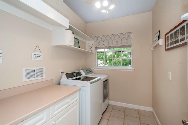 8335 Lake Burden Cir, Windermere, FL 34786 - washroom with independent washer and dryer, baseboards, and light tile patterned flooring