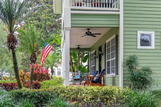 8335 Lake Burden Cir, Windermere, FL 34786 - porch featuring ceiling fan and a balcony