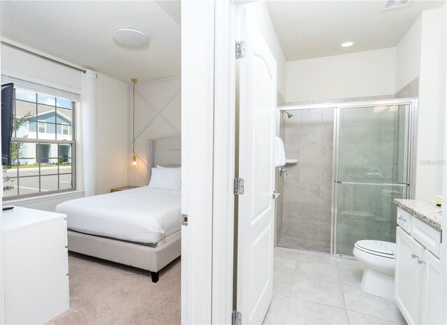 2439 Dubai St, Kissimmee, FL 34747 - bathroom featuring vanity, a stall shower, toilet, tile patterned floors, and recessed lighting