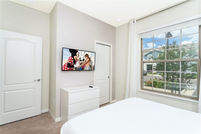 2439 Dubai St, Kissimmee, FL 34747 - bedroom with light colored carpet and baseboards