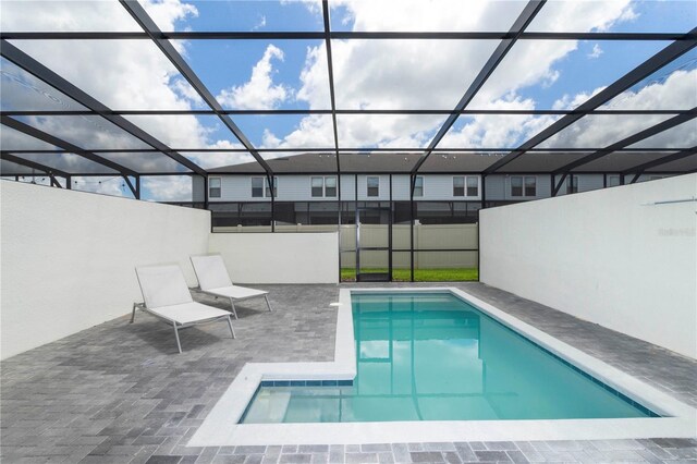 2439 Dubai St, Kissimmee, FL 34747 - view of swimming pool featuring a patio