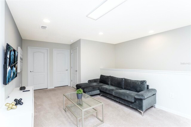 2439 Dubai St, Kissimmee, FL 34747 - living area with light carpet, baseboards, and recessed lighting