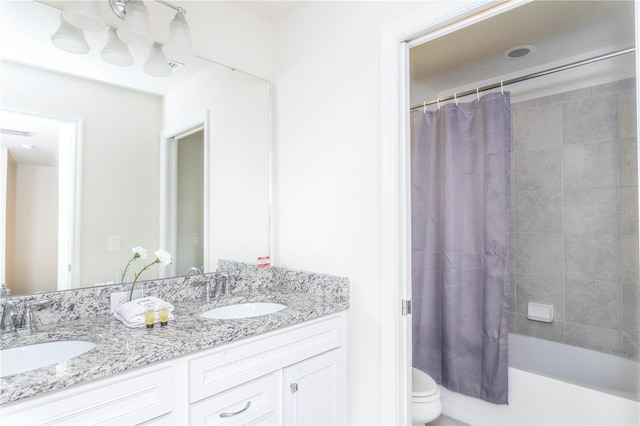 2439 Dubai St, Kissimmee, FL 34747 - full bath with double vanity, shower / bath combo, and toilet