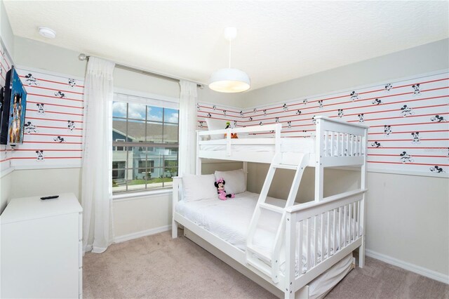 2439 Dubai St, Kissimmee, FL 34747 - carpeted bedroom with baseboards