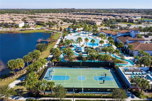 2439 Dubai St, Kissimmee, FL 34747 - aerial view of residential area featuring a pool and a nearby body of water